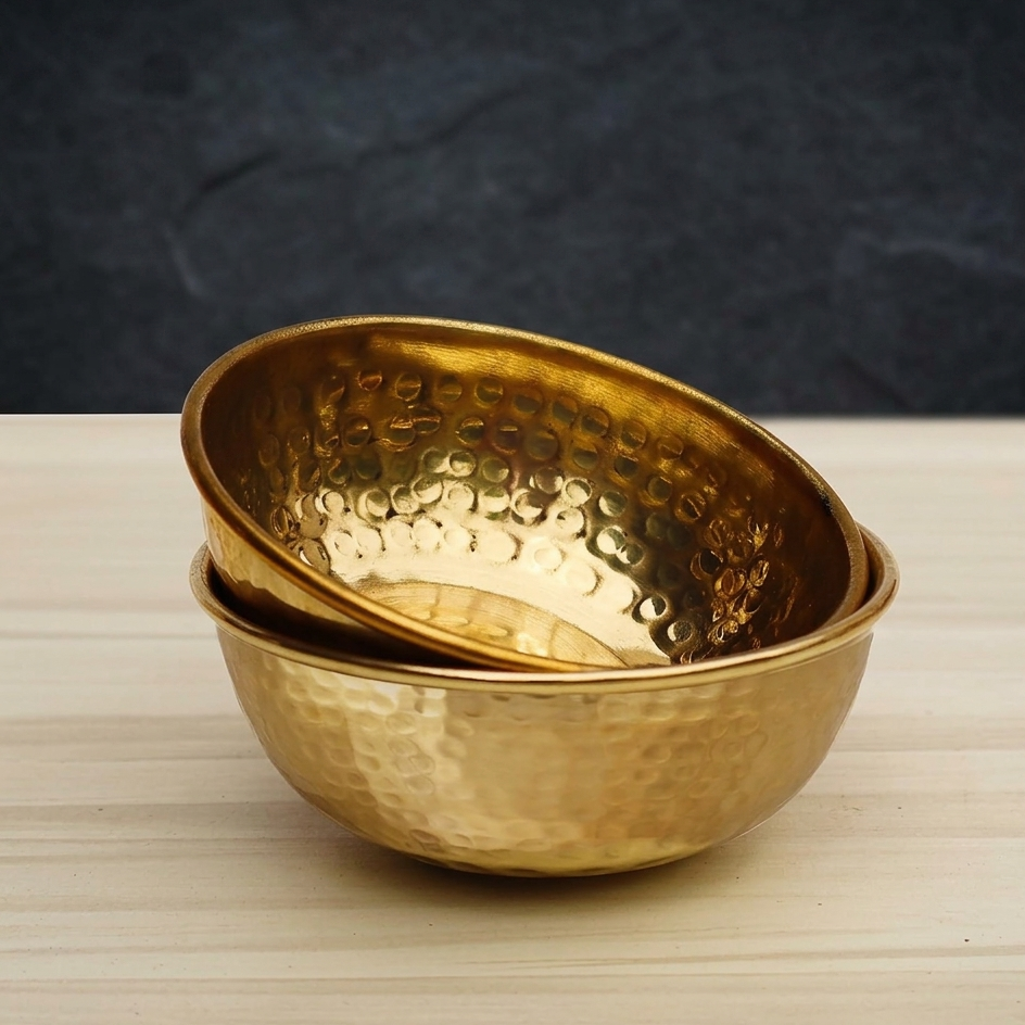 Handmade brass bowls manufactured in India featuring decorative, serving, hammered, engraved, and custom brass bowl designs for wholesale buyers and global importers.