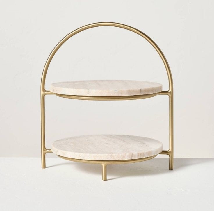 Round marble 2-tier serving stand with handcrafted brass frame for luxury dining and home décor.