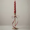 Handcrafted burgundy spiral taper candle with elegant gold metal stand for home décor, weddings, and wholesale export from India.
