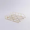 Modern brass decorative serving tray with geometric wireframe design