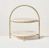 Round marble 2-tier serving stand with handcrafted brass frame for luxury dining and home décor.