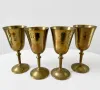 Handcrafted solid brass goblets with polished finish displayed as premium wholesale brass drinkware for hospitality, gifting, and international export markets.