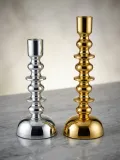 Contemporary metal pillar candle holder in premium gold and silver finish
