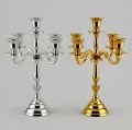 Five arm metal candelabra in polished gold and silver finish