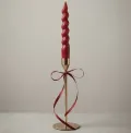 Handcrafted burgundy spiral taper candle with elegant gold metal stand for home décor, weddings, and wholesale export from India.