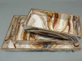Handcrafted marble print wooden serving tray set with elegant gold borders.