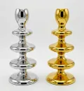 Modern sculptural metal candle holder in gold and silver finish