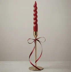 Handcrafted burgundy spiral taper candle with elegant gold metal stand for home décor, weddings, and wholesale export from India.