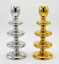 Modern sculptural metal candle holder in gold and silver finish
