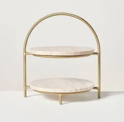 Round marble 2-tier serving stand with handcrafted brass frame for luxury dining and home décor.